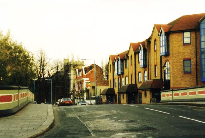 Modern office block, the Six Bells PH and St Lawrences Church