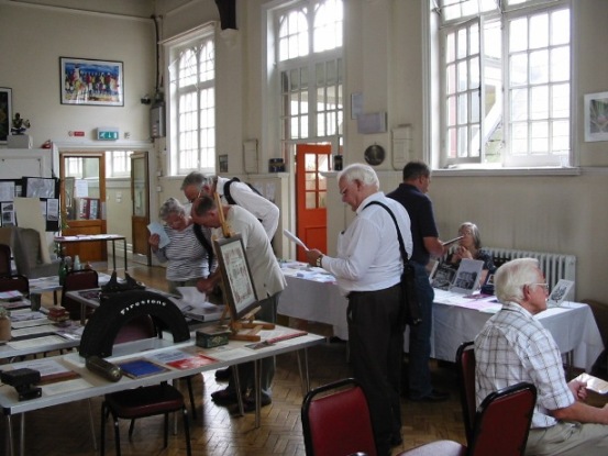 View of the local history book sales and local interest table, items include a Firestone Tyre and Smiths Crisp tin