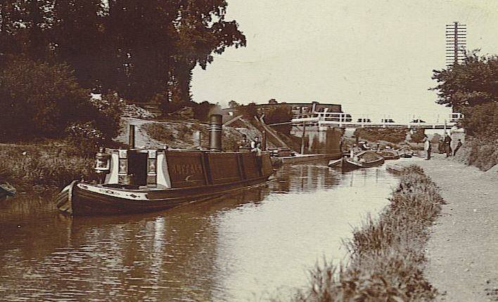 View of canal with barge and other boats
