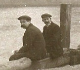 Enlargement showing 2 men