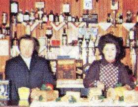 Vic & Ann Edmunds serving at bar