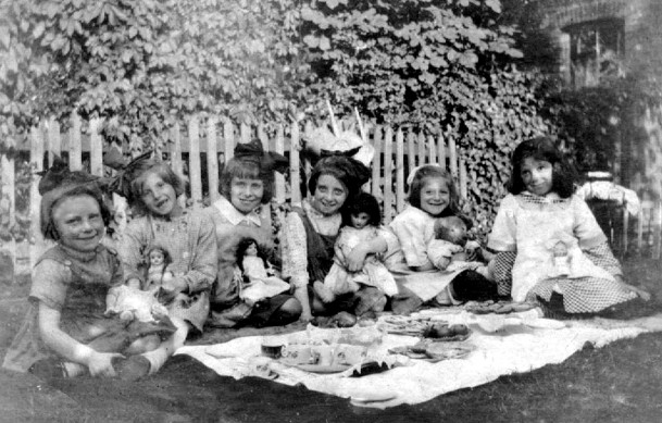 6 small girls at outdoor tea party