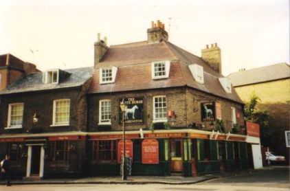 White Horse: two storey plus attics with dormer windows, corner position, brick built pub (Charringtons); 2002