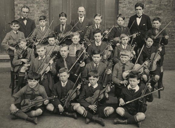 Outdoor photo of a violin class